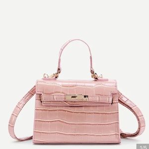Pink faux crocodile skin purse